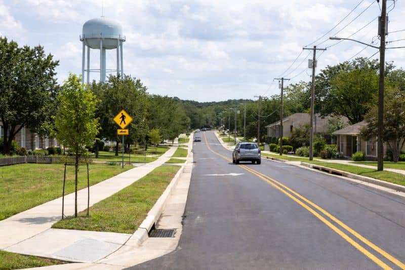 Suburban street and local infrastructure in a small Texas city supporting steady population growth